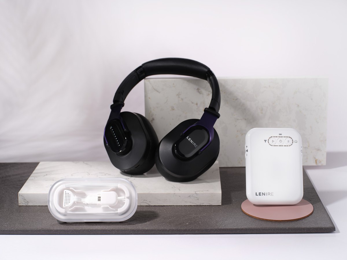 The Lenire tinnitus treatment device — Bluetooth headphones, handheld controller and Tonguetip