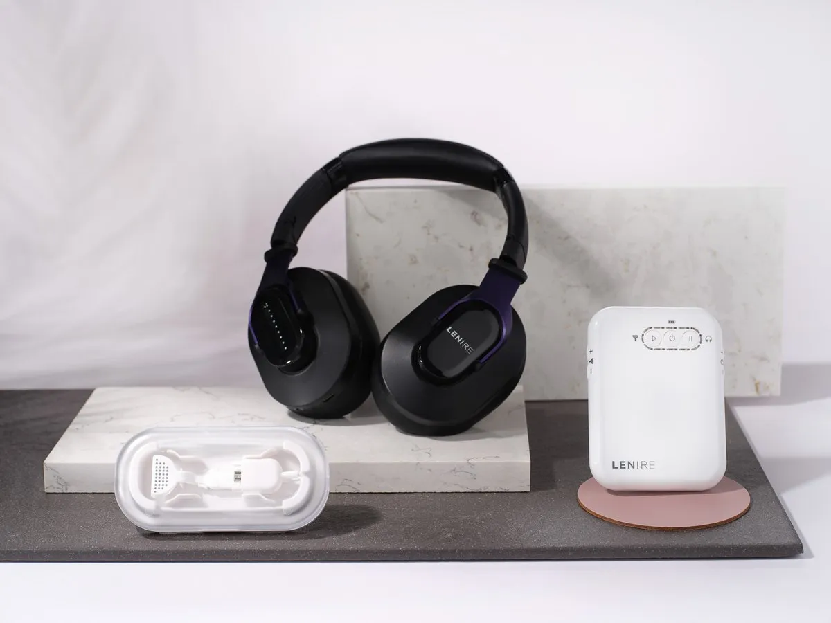 The Lenire tinnitus treatment device — Bluetooth headphones, handheld controller and Tonguetip